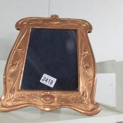 An art nouveau copper photograph frame.