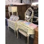 A white ormalu bedroom set consisting of dressing table, mirror, 3 drawer chest,
