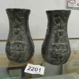 A pair of art nouveau bronze vases.