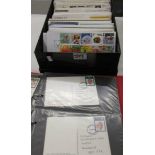 An album and a box of first day covers.