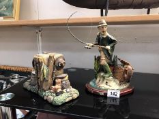 Pair of fishing themed book ends and a figure 'hooked on Fishing' by Brian Andrew,