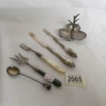 A silver sweetmeat fork, 1881, a silver eel fork, 1906, A Scottish silver spoon,