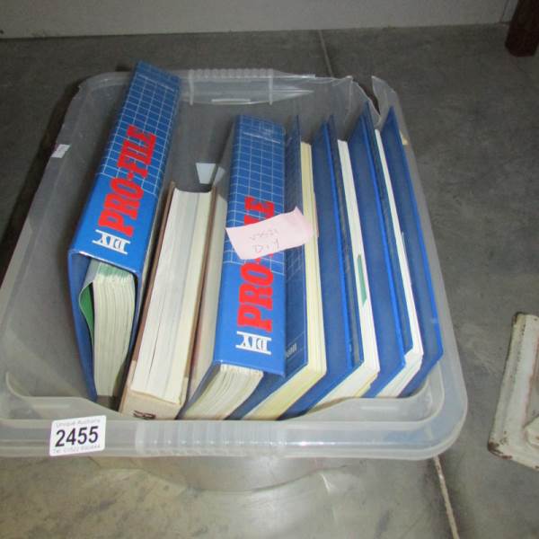 A box of DIY Pro-file magazines in binders.