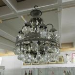 A metal and glass chandelier, for restoration.
