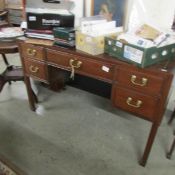 A mahogany writing desk.