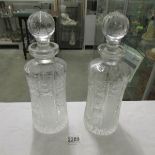 A pair of vintage heavy glass decanters.