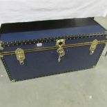 A large good clean cabin trunk with key.