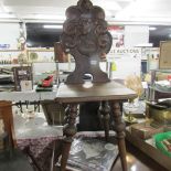 A Victorian carved oak hall chair with bird motif.