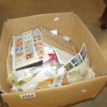 A large box of assorted postage stamps.