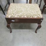 A mahogany piano stool.