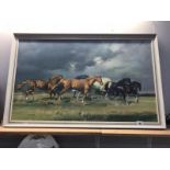 A framed galloping horses picture