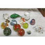 A mixed lot of glass paperweights,.