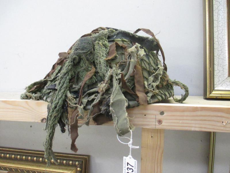 A military camouflage helmet