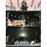 3 shelves of Christmas decorations