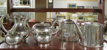 A Walker and Hall 4 piece silver plate teaset together with 2 teapots.