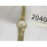 An Omega ladies wrist watch in 9ct gold, in working order, approximate total weight 17.7 grams.