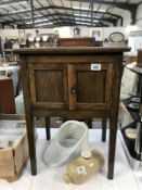 A 1930's oak work cupboard/table