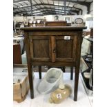 A 1930's oak work cupboard/table