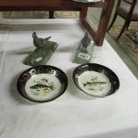 A pair of silver plate pheasant bookends and 2 plates featuring fish.
