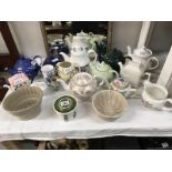 A quantity of teapots, jugs etc.