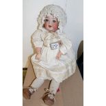 An early 20th century porcelain headed German doll marked on neck 342-2 Germany.