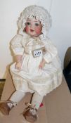 An early 20th century porcelain headed German doll marked on neck 342-2 Germany.