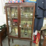 A mahogany display cabinet.