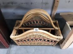 A wicker magazine rack