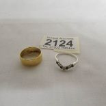 A 22ct gold wedding band, size L (6 grams) and a silver ring.