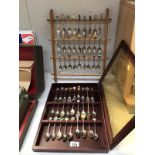 A cased lot of collectable spoons and I other lot