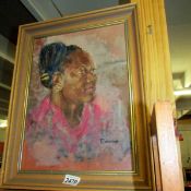 A mid 20th century portrait of a black lady signed R Warriner.