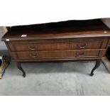 A 2 drawer dark wood cupboard