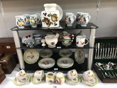 3 shelves of kitchen ware including chicken tea set, pestle and mortar etc.