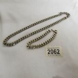 A heavy silver neck chain and a silver wrist chain, approximately 115 grams.