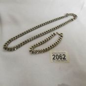 A heavy silver neck chain and a silver wrist chain, approximately 115 grams.