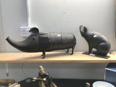 A pig door stop and 1 other