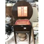 A vintage sewing table and sewing basket