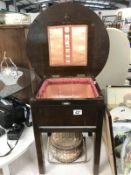 A vintage sewing table and sewing basket