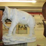 A plaster figure of an elephant.