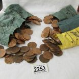 A large quantity of pre decimal pennies in bags.