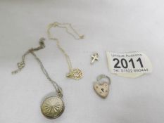 A 9ct gold Star of David pendant on gold chain, a silver locket and 2 other silver items.