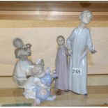 3 NAO figurines being boy & girl in nightgowns, girl with dog and girl with rabbit.