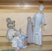 3 NAO figurines being boy & girl in nightgowns, girl with dog and girl with rabbit.