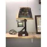 An unusual music box/lamp with hunting theme shade