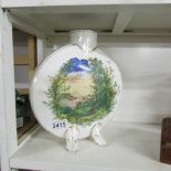 A 19th century flask hand painted with a lake scene.