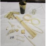 A mixed lot of bone and ivory items.