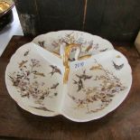 A 3 compartment hors d'ouvre dish decorated with birds.