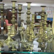 A mixed lot of brass candlesticks etc.