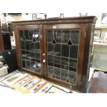 An oak lead glass bookcase