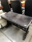 A Victorian ebonised table